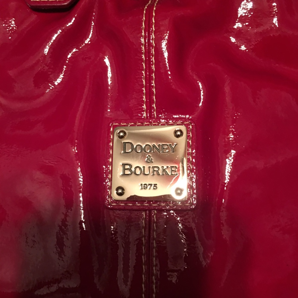 Red patten leather Downey and Burke purse .